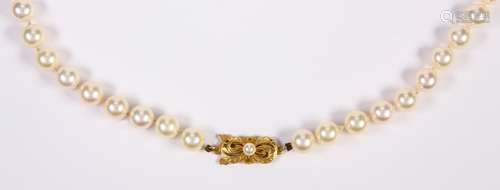 Mikimoto cultured pearl and 18k yellow gold necklace Composed of (57), 7.0 mm cultured pearls,