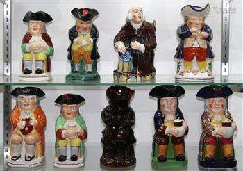 (lot of 9) Toby Jug group, consisting of a brown salt glazed example, the rest all polychrome