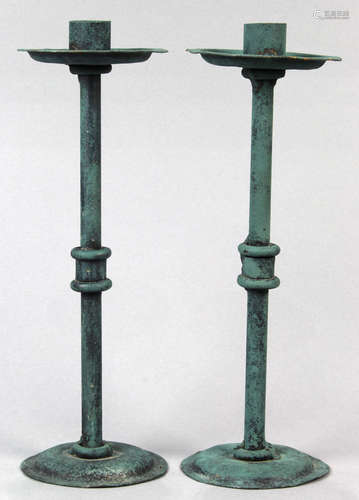 Pair of modern green patinated candle holders, having a wide bobeche over the skinny cylindrical