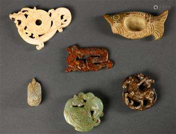 (lot of 6) Chinese archaistic hardstone carvings, including a fish with a well to the center; a