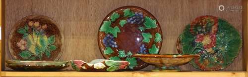 (lot of 7) One shelf of majolica ceramic table articles, consisting of plates and a tazza, each