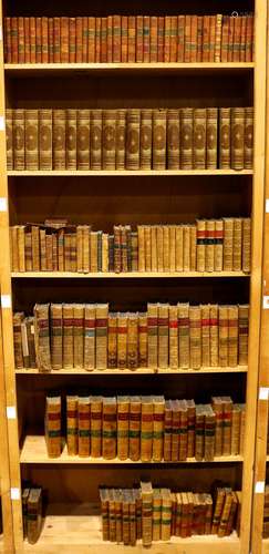 Six shelves of leather bound books, mostly relating to literature including Thackeray's Works,