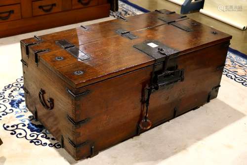 Korean storage chest with iron fittings, large lock and a key, on two strech bar supports, 17