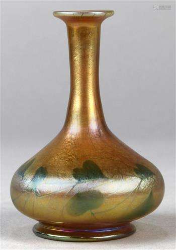 Miniature Tiffany Studios Favrile stick neck vase, executed in gold aurene with green heart accents,