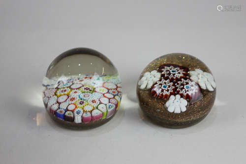 Two millefiori glass paperweights, one polychrome, the other with brown glitter design, largest