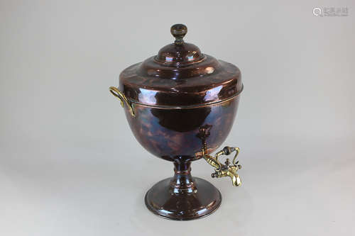 A copper samovar, with wooden finial, two brass handles and tap, on circular base, 50cm high