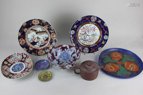 A Japanese terracotta teapot, two cloisonné dishes, an Imari oval dish, two ironstone plates in