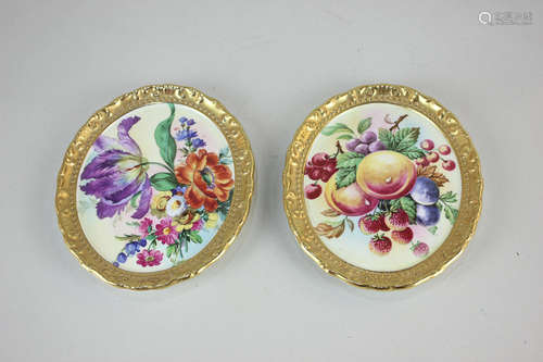 A pair of Paragon porcelain oval wall plaques with hand painted designs of flowers and fruit, with