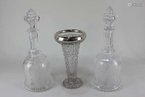 A George V silver mounted moulded glass vase, together with a pair of cut glass decanters with