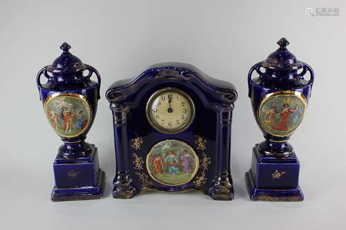 A Victorian Empire ware porcelain clock garniture depicting three classical women dancing, playing