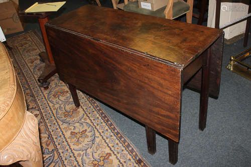 A 19th century mahogany drop-leaf table, on chamfered legs, 123.5cm fully extended