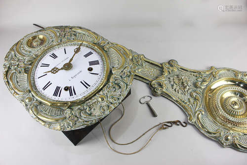 A 19th century gilt brass Comtoise wall clock the embossed oval surround with 8 inch white