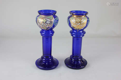 A pair of Victorian blue glass vases, each with floral decoration and gilt embellishments, 22cm