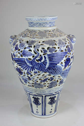 A blue and white glazed pottery vase, probably Chinese, of baluster form, decorated with storks,