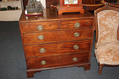 A 19th century mahogany chest of two short over three long graduated drawers with brass drop handles