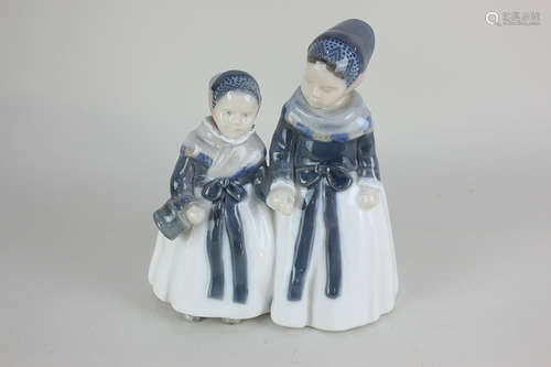 A Royal Copenhagen porcelain figure of two young girls holding hands, 18.5cm