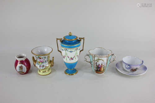 A Dresden porcelain chocolate cup, a French porcelain baluster spill vase, an urn and cover with