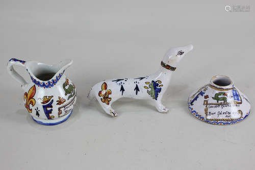 Three pieces of faience pottery, each inscribed 'Chambord', comprising an inkwell and milk jug, both