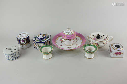 A collection of eight 19th century and later porcelain inkwells, one by Chamberlains Worcester,