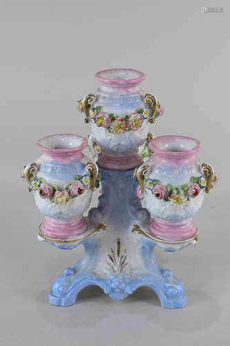 A 19th century French (possibly Charenton) porcelain centrepiece with four floral bocage decorated