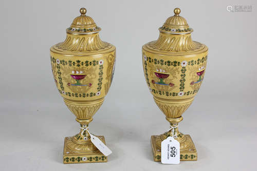 A pair of 19th century Continental porcelain vases and covers, each decorated with a circular