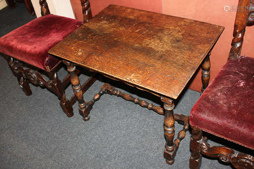 An oak side table with rectangular top, on turned supports with uniting stretcher, 67cm