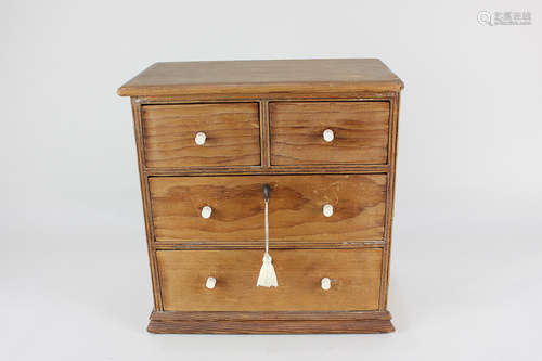 A miniature pine chest of two short over three long drawers (both lockable) 26.5cm