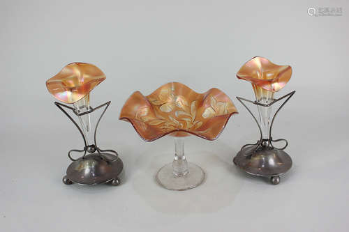 A pair of carnival glass epergnes in the form of lily flowers on metal stands, and a similar glass