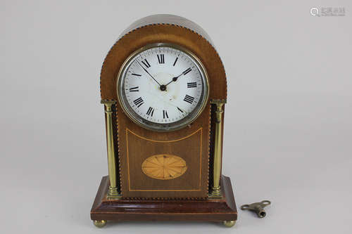 An Edwardian inlaid mahogany mantel clock, white enamel dial (with hairlines), in domed case with