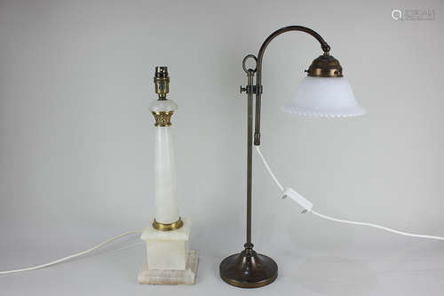 A white marbled stone column table lamp base with brass mounts, together with a brass adjustable