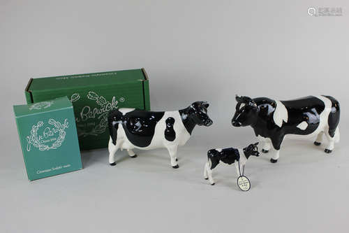 A Beswick model of a Friesian bull 'Coddington Hilt Bar', 12cm, together with a Beswick Friesian