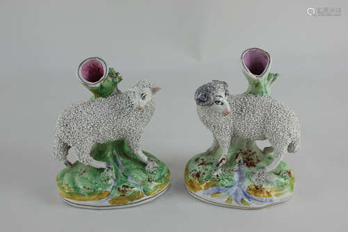 A pair of Staffordshire spill vases modelled as a ram and a sheep, 13.5cm, (a/f)