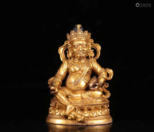 A TIBETAN GILT BRONZE HUANGCAISHEN BUDDHA STATUE