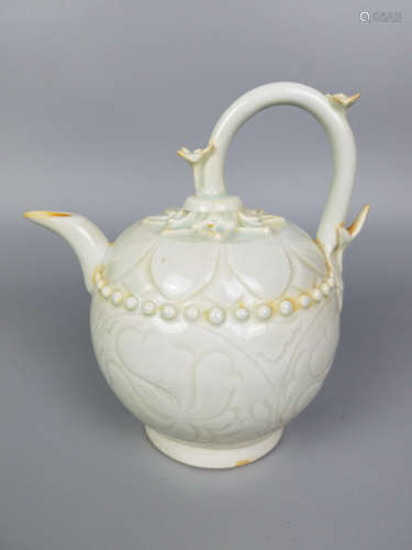 A HUTIAN YAO INCISED FLORAL PATTERN EWER