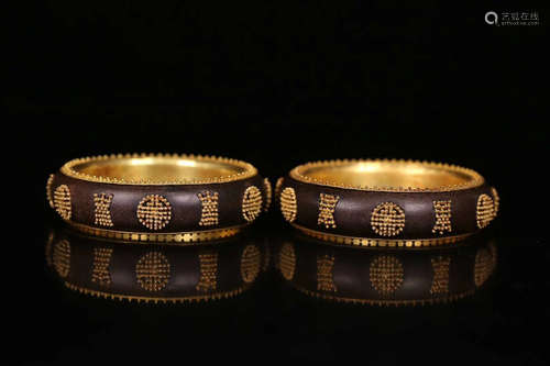 PAIR CHENXIANG WOOD GILT BANGLES