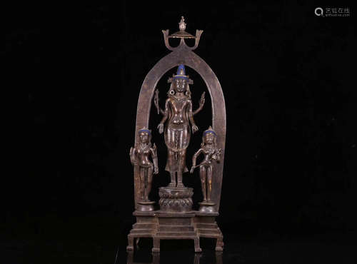 A BRONZE FOUR-ARM GUANYIN STATUE