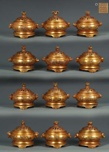 SET OF 12 GILT COPPER BEAST PATTERN CENSERS