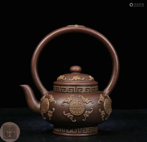 A SINGLE HANDLE ZISHA TEAPOT