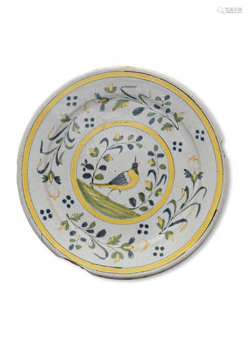 A 19th century polychrome decorated faience dish, Spanish