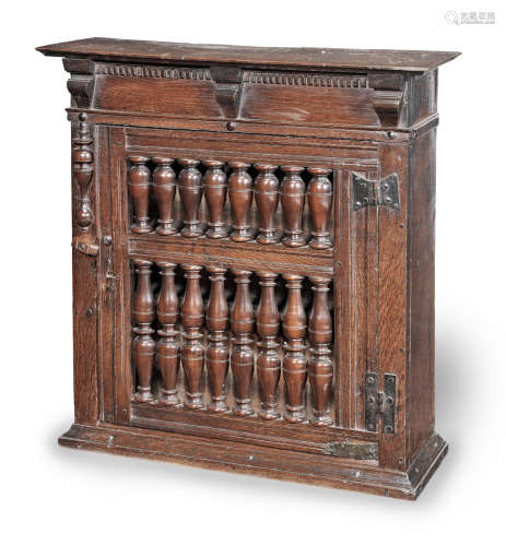 A Charles II joined oak and fruitwood ventilated mural food cupboard, circa 1660
