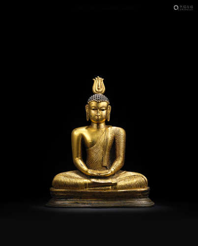 Sri Lanka, Kandyan Period, 18th century A GILT COPPER ALLOY FIGURE OF SEATED BUDDHA WITH INSET LAPIS LAZULI EYES