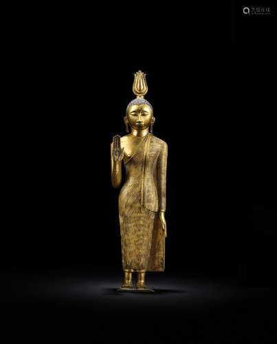 Sri Lanka, Kandyan Period, 18th century A GILT COPPER ALLOY FIGURE OF STANDING BUDDHA