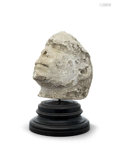 Possibly 15th century A limestone sculptural fragment, French, possibly the head of St. Denis