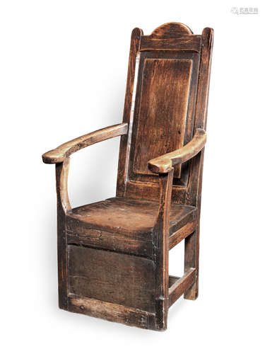 A William & Mary joined fruitwood, sycamore, elm and oak panel-back open armchair, with part enclosed base, possibly Welsh, circa 1690