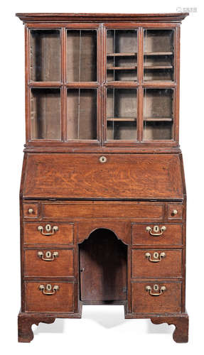 A George II joined oak knee-hole bureau cabinet, circa 1740