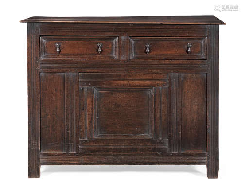 A Charles II joined oak standing fully-enclosed livery cupboard, circa 1660