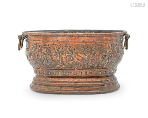 A late 17th/early 18th century repoussé-decorated copper wine cistern, German, bearing the arms of the city of Nuremberg