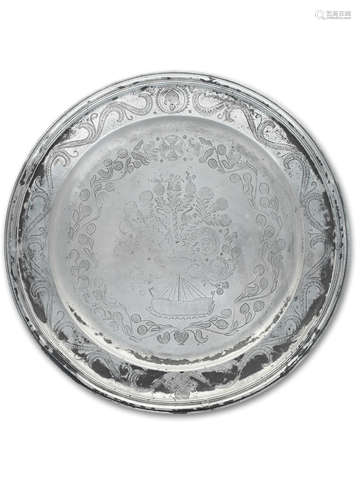 A large pewter wrigglework charger, French, circa 1700