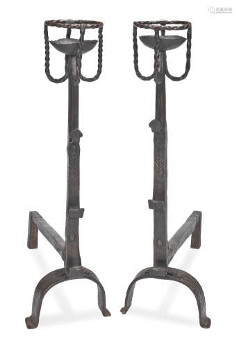 A pair of wrought iron cresset-topped spit dogs, in the 16th/17th century manner