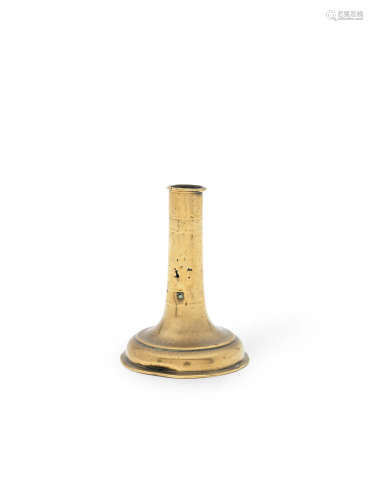 A small mid-17th century trumpet-based brass alloy socket candlestick, English, circa 1650